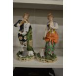 A pair of porcelain figures.