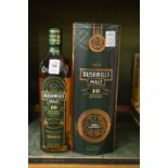 A bottle of Bushmills ten year old single malt Irish whiskey made to commemorate the 400th