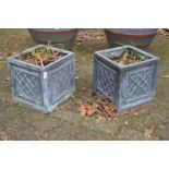 A pair of square lead style garden planters.