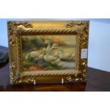 Two small oil on boards depicting chickens and geese in decorative gilt frames.