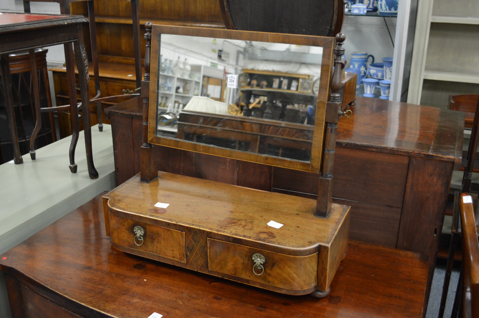 A good George III mahogany dressing table mirror with two drawers to the base.