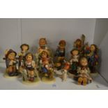 A collection of Goebel and Hummel figures.