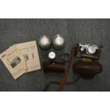 A Leica 35mm camera with leather case and accessories to include lenses, instruction books etc.