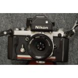 A Nikon F2 camera with 50mm lens and case.