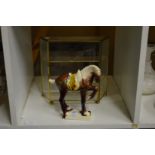 A Tang style horse and a miniature display cabinet.