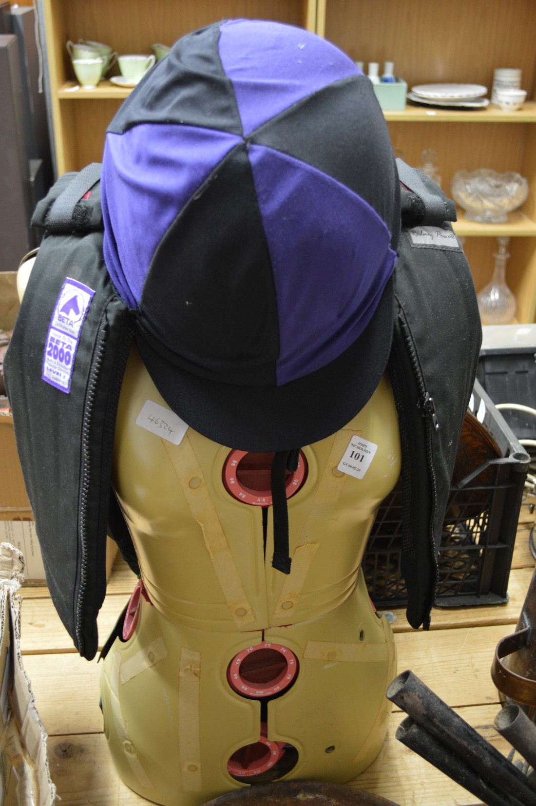A jockeys waistcoat and hat.