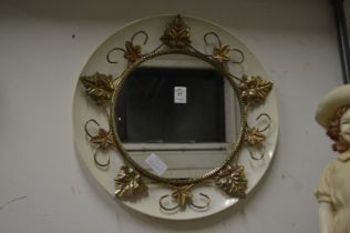 A decorative circular mirror.