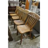 A set of four beech and elm kitchen chairs.