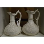 A pair of moulded jugs.