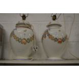 A large pair of floral decorated lamp bases.