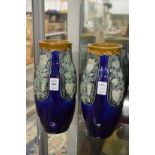 A pair of Royal Doulton vases, one cracked.