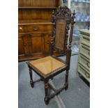 An oak high back cane seated dining chair.