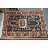 A small Persian rug, blue ground with geometric decoration 4' x 2'8".