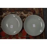 A pair of celadon dishes.