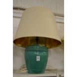 A green glazed pottery table lamp and shade.