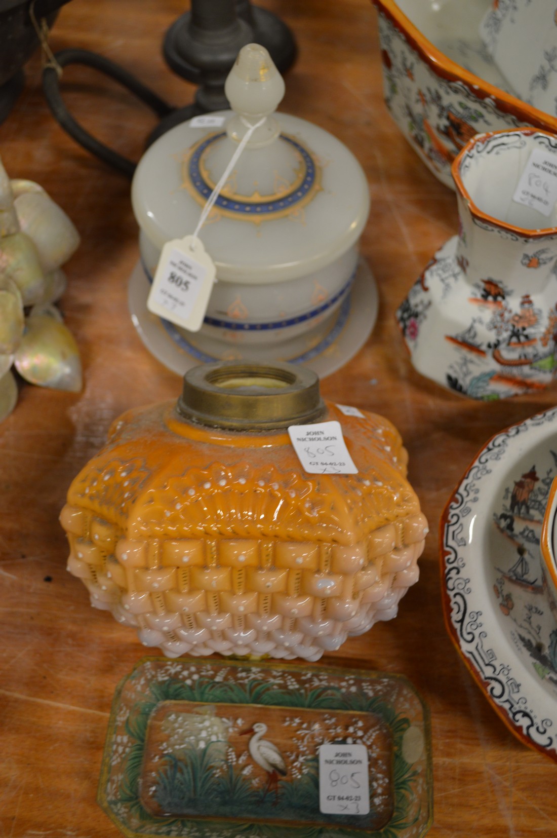 An opaque glass bowl with cover and stand, a glass oil lamp reservoir and a decorative glass dish