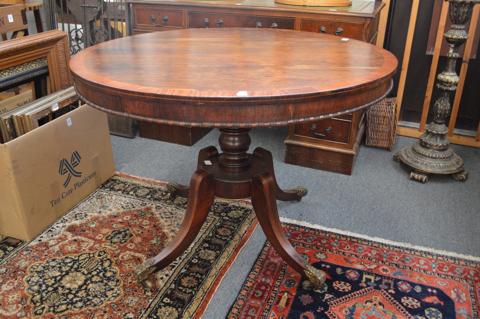 A good regency rosewood and mahogany banded circular tilt top breakfast table of small size, the