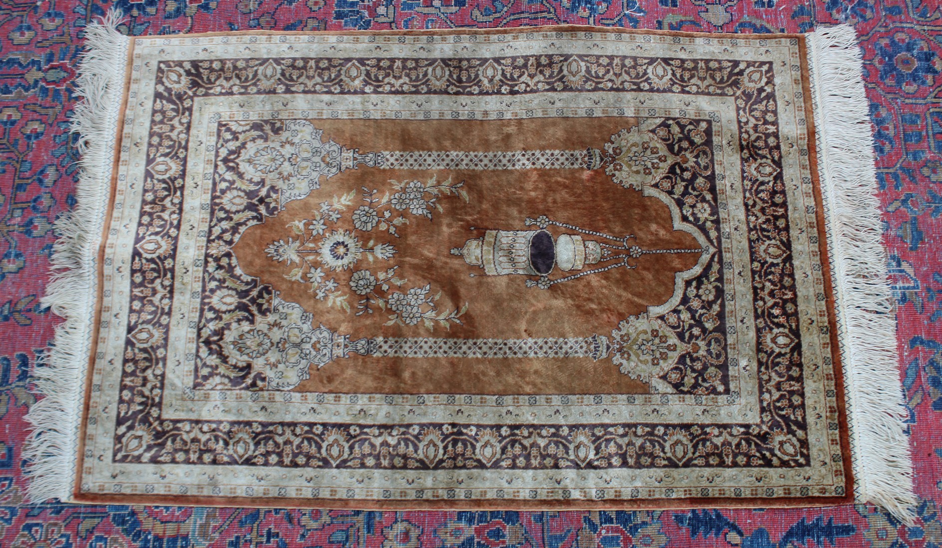 A small Persian silk prayer rug, brown ground with temple arch and hanging lantern 3'1" x 2'.