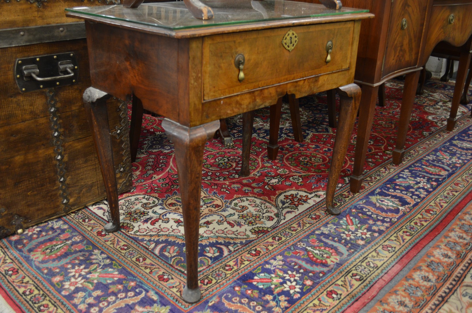 An 18th century walnut single drawer side table on cabriole legs.