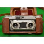 An Edixa stereo camera with leather case.