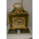 An Elsinor onyx and gilt decorated mantle clock.