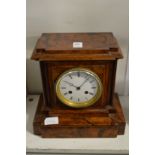 A walnut cased mantle clock.