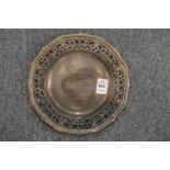 A silver presentation dish with pierced border.