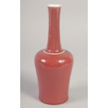 A CHINESE REPUBLIC COPPER RED GLAZE BOTTLE VASE, the base with character mark, 23cm high.