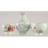 A GROUP OF THREE YUAN STYLE PORCELAIN ITEMS, comprising two cups and a vase, (3).