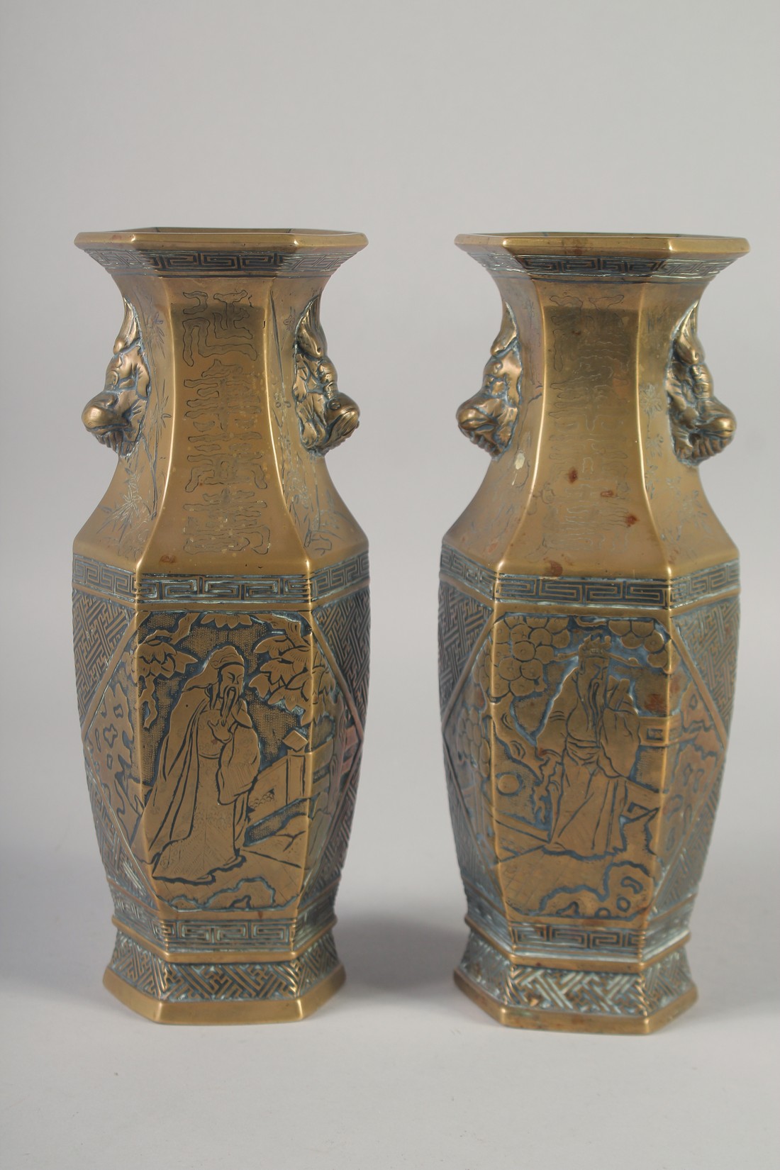 A PAIR OF 19TH CENTURY CHINESE BRONZE HEXAGONAL VASES, engraved with figures and with twin lion - Image 3 of 6