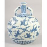 A CHINESE BLUE AND WHITE PORCELAIN TWIN HANDLE MOON FLASK, painted with cranes and clouds, bearing