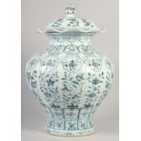 A VERY LARGE CHINESE BLUE AND WHITE PORCELAIN PETAL FORM JAR AND COVER, decorated with panels of