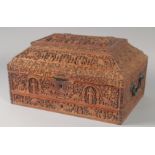 A VERY FINE AND LARGE MID-19TH CENTURY ANGLO INDIAN MYSORE HEAVILY CARVED SANDALWOOD SEWING BOX,