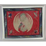 AN EARLY 20TH CENTURY CHINESE TEXTILE OF A PHOENIX, framed and glazed, textile 46cm x 36cm.