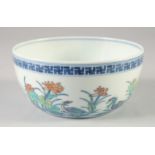 A CHINESE DOUCAI PORCELAIN BOWL, painted with birds and flora, six-character mark to base, 16cm