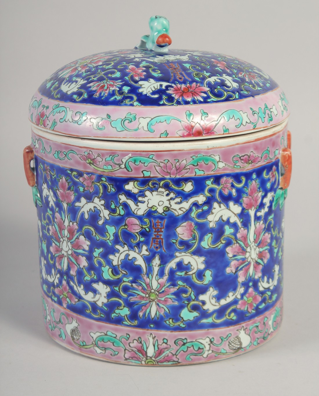 A CHINESE FAMILLE ROSE PORCELAIN JAR AND COVER, painted with bats and floral motifs, 23cm high.