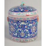 A CHINESE FAMILLE ROSE PORCELAIN JAR AND COVER, painted with bats and floral motifs, 23cm high.