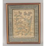 A 19TH CENTURY CHINESE SILK PANEL, depicting a Chinese love story, framed and glazed, 43cm x 34.