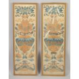 A PAIR OF 19TH CENTURY CHINESE SILK PANELS OF FLOWER VASES, framed and glazed, textile 65cm x 19.