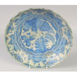 A FINE 17TH CENTURY PERSIAN SAFAVID BLUE AND WHITE DISH, with floral decoration, 28.5cm diameter.