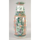 A LARGE CHINESE FAMILLE VERTE POLYCHROME VASE, with molded foo dog handles and chilong, painted with