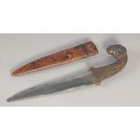A 19TH CENTURY PERSIAN QAJAR DAGGER, with ram's head handle and leather overlaid wooden scabbard,