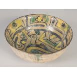 A FINE 9TH-10TH CENTURY PERSIAN NISHAPUR POTTERY BOWL, the interior painted with a bird, 15cm