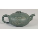 A CHINESE GREEN YIXING TEAPOT, impressed trade mark to base, 19cm spout to handle.