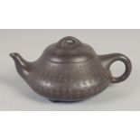 A SMALL CHINESE YIXING TEAPOT, with calligraphy, impressed trade mark to base, 14.5cm spout to