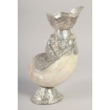 A BURMESE SILVER AND MOTHER OF PEARL CONCH SHELL VASE, 25.5cm high.