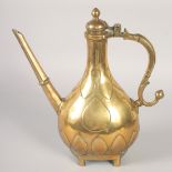 A FINE 19TH CENTURY ISLAMIC BRASS EWER, with hinged lid and raised on four feet, 30cm high.