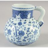A CHINESE BLUE AND WHITE PORCELAIN JUG, with floral decoration, bearing six-character mark, 14cm