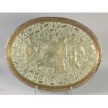 A LARGE JUDAICA EMBOSSED BRASS OVAL TRAY, with chased decoration depicting figures and Judiaca