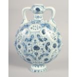 A CHINESE BLUE AND WHITE PORCELAIN TWIN HANDLE MOON FLASK, with floral motifs, 28cm high.